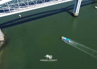 Little boat below the Tamar Bridge