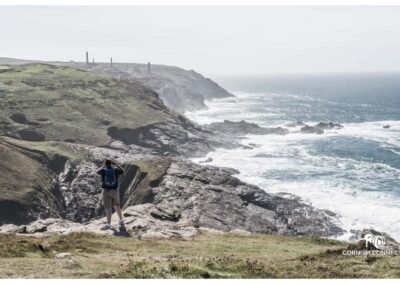 Man taking a photo at Pendeen